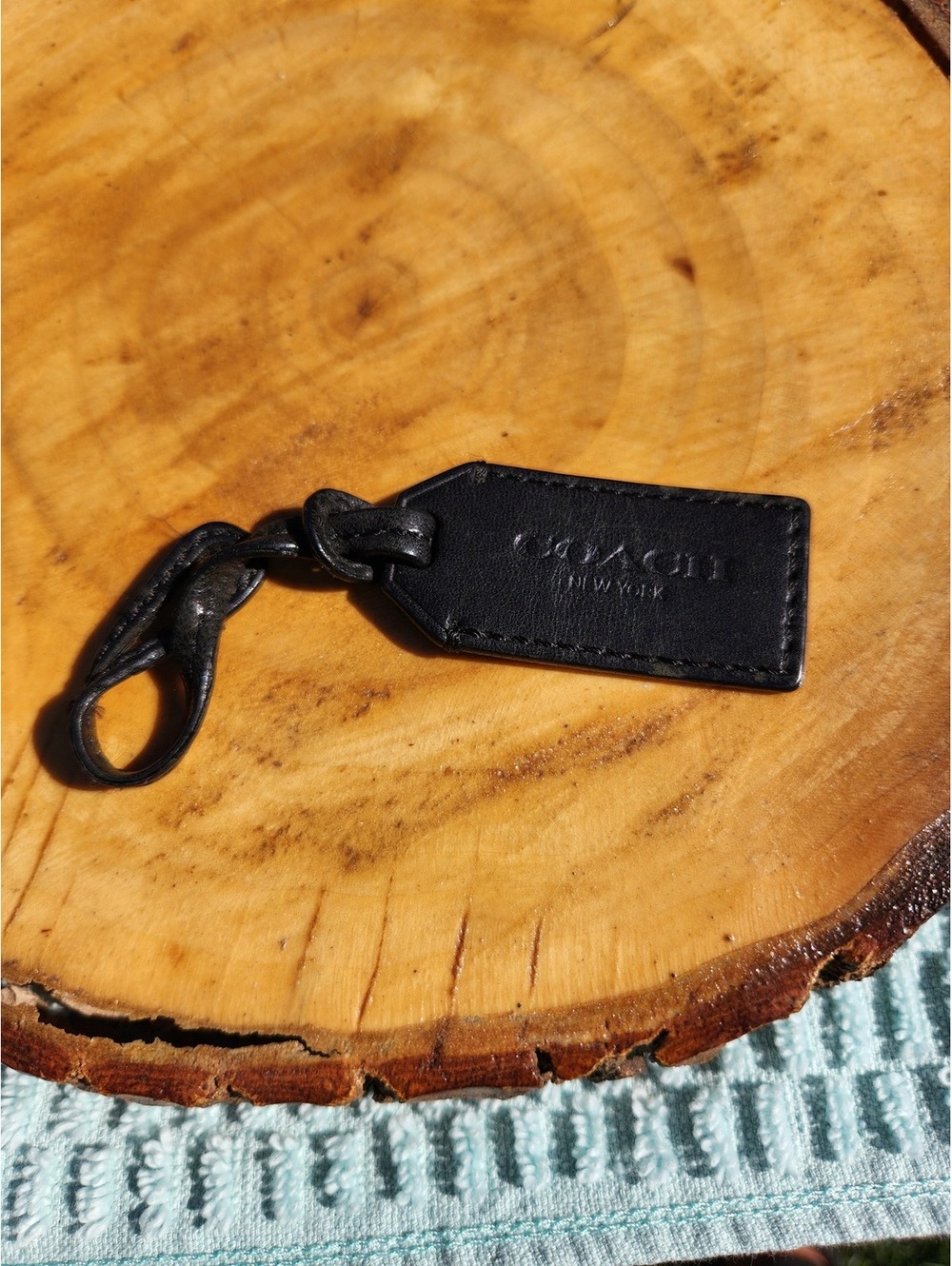 Coach black leather luggage tag